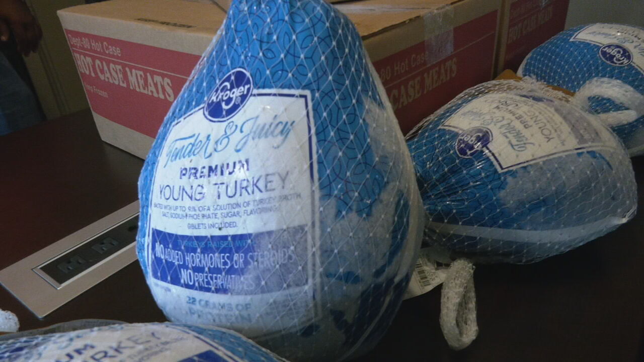 Louisville's Community Connections Group delivers frozen turkeys and chicken to community members ahead of the Thanksgiving holiday